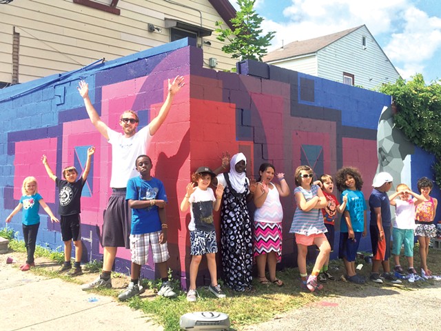 Sloan Collins and his helpers in front of a mural supported by the BCA Community Fund - COURTESY OF BURLINGTON CITY ARTS