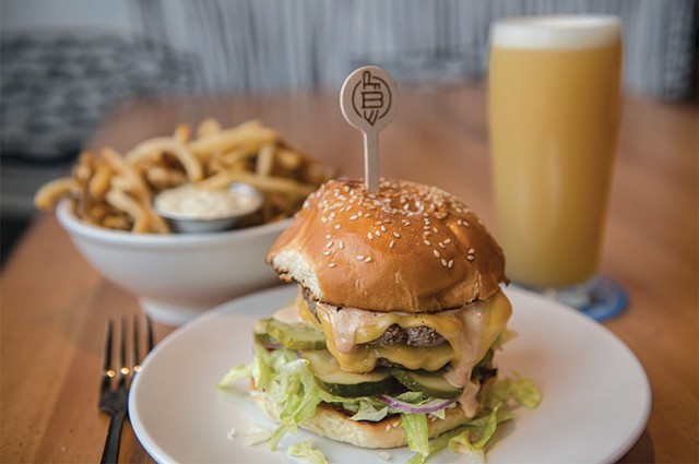 Double-stack smash burger with hand-cut fries and an Elaborate Metaphor pale ale at Burlington Beer - FILE: DARIA BISHOP