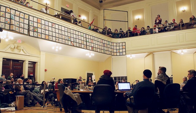 Activists packed Burlington City Hall on Monday. - COURTNEY LAMDIN