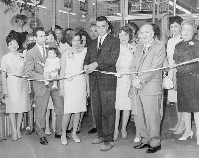 Marvin, Carol, Martha and Ed Needleman flanking  Newport mayor Melvin Carter (center) at the grand opening of a Needleman's store in 1965 - COURTESY