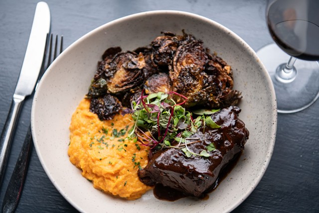 Beer-braised boneless short rib, sweet potato pur&eacute;e and fried Brussels sprouts - DARIA BISHOP