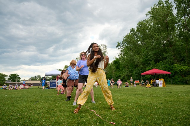 Members of the Judi Emanuel Family Band leading the crowd in a dance at a Juneteenth celebration in Burlington - BEAR CIERI