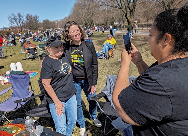 Cheryl Solis of Fall River, Mass., taking a photo of a relative with Mulvaney-Stanak - COURTNEY LAMDIN ©️ SEVEN DAYS