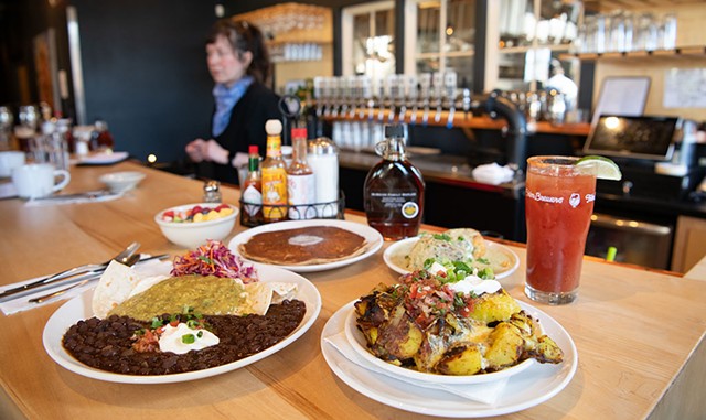 Huevos verdes, fresh fruit cup, griddled gingerbread pancake, biscuits and gravy, michelada, and House of Spudology home fries - DARIA BISHOP