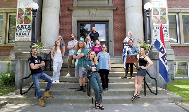 The Catamounts Arts staff in front of their building in St. Johnsbury - STEVE LEGGE