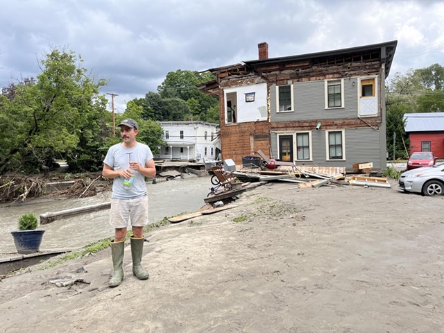 Eli Barlow standing in the spot where his second-floor apartment used to be - ANNE WALLACE ALLEN ©️ SEVEN DAYS