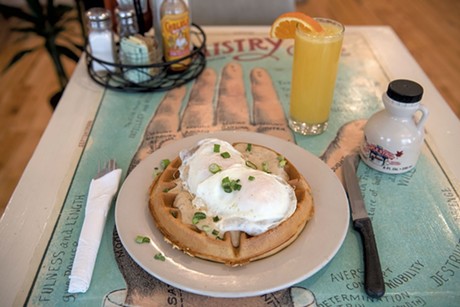 Chicken and waffles with a mimosa at Sneakers Bistro - FILE: DARIA BISHOP