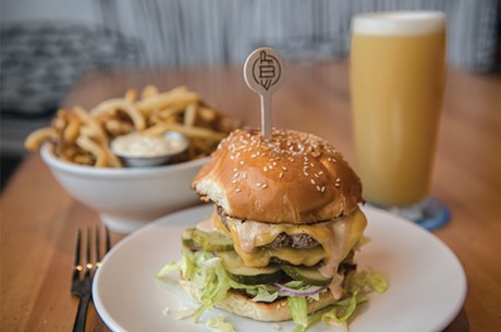 Double-stack smash burger with hand-cut fries and an Elaborate Metaphor pale ale - FILE: DARIA BISHOP