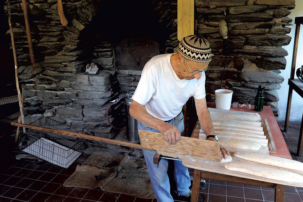 Jules Rabin getting bread ready for the oven at Upland Bakers in 2013