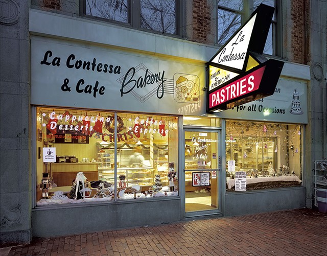 "Front of 'La Contessa Bakery &amp; Cafe' decorated for Christmas" by Jim Dow