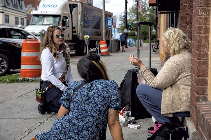 Marsha McCombie (left) and Lacey Smith (center) meeting with Debbie on Main Street - JAMES BUCK