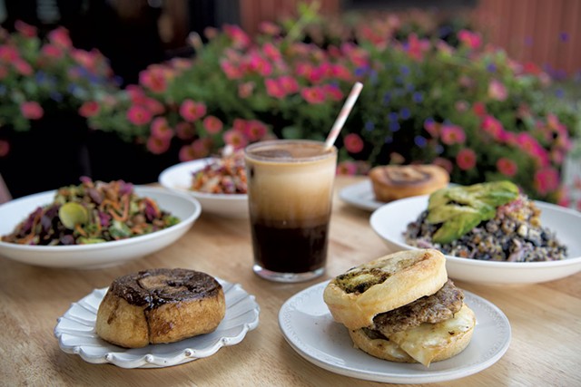 Front, from left: O.G. bun, North Star iced coffee and broccoli-cheddar bun breakfast sandwich at Haymaker Bun - DARIA BISHOP