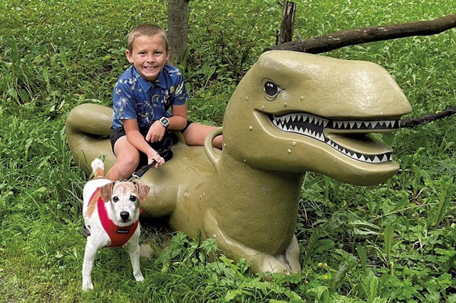 Deborah Van Ness' nephew, Joseph, on the T. rex - COURTESY