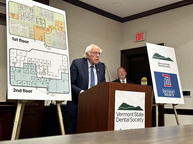 Sen. Bernie Sanders standing at a podium during Friday's press conference