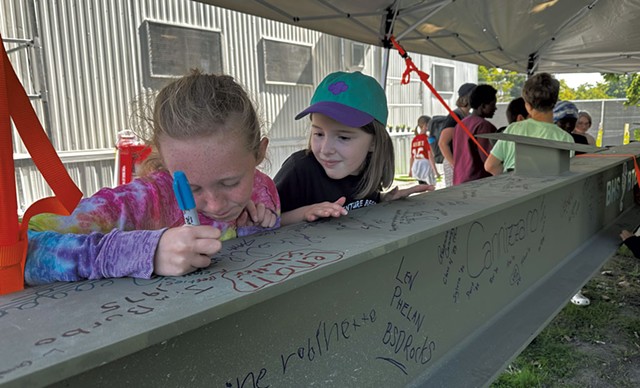 Kids signing the beam at the site of the new Burlington High School - ALISON NOVAK ©️ SEVEN DAYS