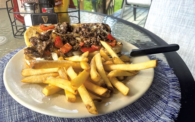 Cheesesteak with fries at Dumb Luck Pub &amp; Grill - COURTESY