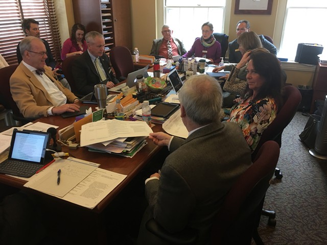Members of the Vermont House Government Operations Committee discussing S.8. - JOHN WALTERS