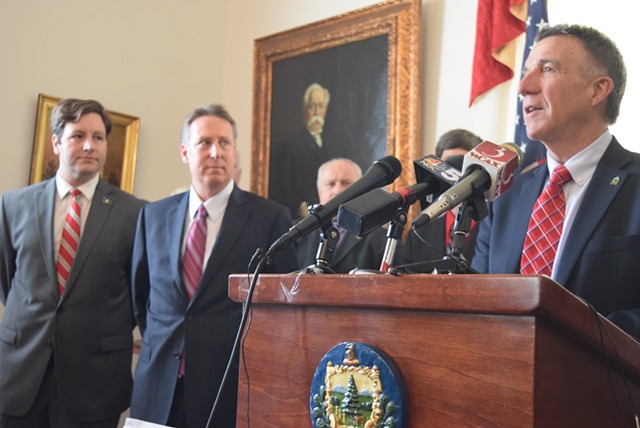 Gov. Phil Scott (right) talks Thursday as court-appointed receiver Michael Goldberg (middle) and Department of Financial Regulation Commissioner Mike Pieciak listen. - TERRI HALLENBECK