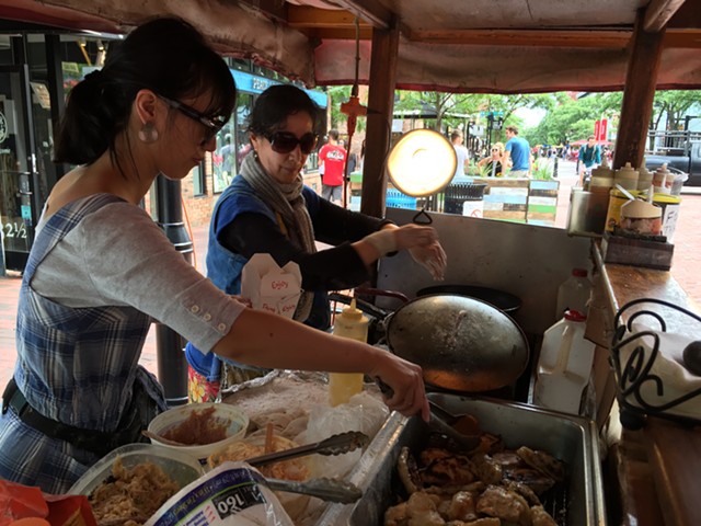 Lisa Li and Hong Yu cook dumplings on Church Street - SALLY POLLAK