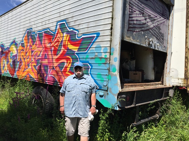 Rick Norcross at his tractor-trailer of Chew Chew Festival gear - SALLY POLLAK