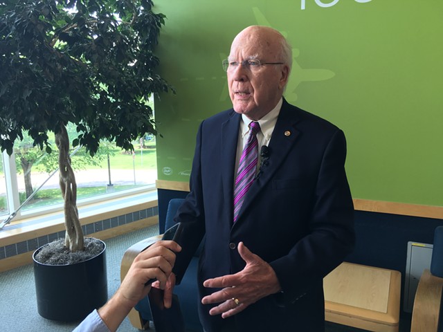 Sen. Patrick Leahy speaks to reporters at Burlington International Airport - JOHN WALTERS