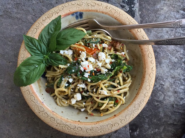 Pasta tossed with wilted kale, tomatoes, feta and pesto. - HANNAH PALMER EGAN