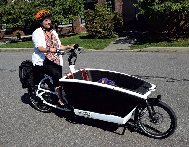 Stephanie Phillips with her family-style scooter - TERRI HALLENBECK