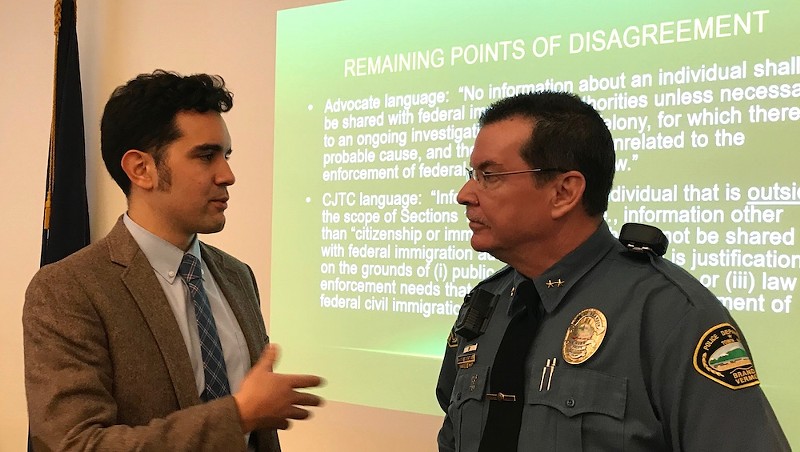 Jay Diaz, a staff attorney for the Vermont chapter of the American Civil Liberties Union, speaks with Brandon Police Chief Christopher Brickell.