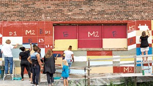 King Street Center and community volunteers painting the Moran Plant with Clark Derbes in 2015