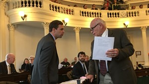 Senate President Pro Tempore Tim Ashe consulting with Sen. Dick Sears during a recess in the S.55 debate