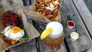 Parmesan truffle fries, Worthy Burger with egg and blue cheese, and the John Daly cocktail