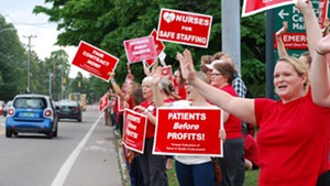 An ambulance, a firetruck and a police car were among the automobiles that honked support for the nurses Thursday.