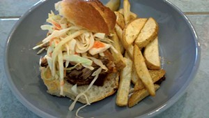 Maple Soul's pulled-pork sandwich with fries