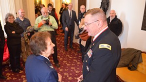Col. Greg Knight speaks to retired colonel Rosanne Greco after  his election as the state's new adjutant general.