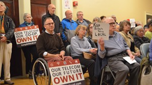 Burlingtonians show support for Keep BT Local at a city council meeting.