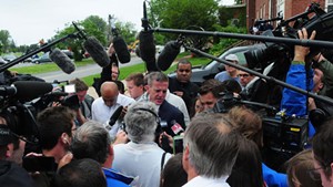 Media mob Clinton County, N.Y., District 
Attorney Andrew Wylie in Plattsburgh.