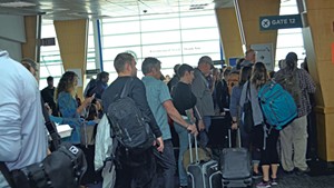 Passengers waiting to board a flight at Burlington International Airport