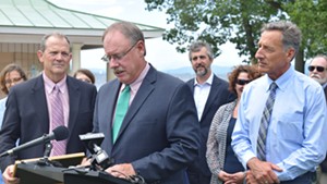 Curt Spalding, Region 1 administrator of the U.S. Environmental Protection Agency, speaks about a new  Lake Champlain cleanup agreement as Gov. Peter Shumlin looks on Friday at North Beach in Burlington.