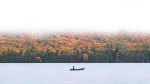 A canoeist out for a morning paddle in the Northeast Kingdom
