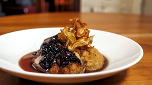 Duck with toasted polenta, a blueberry glaze and sunchoke chips at Sweetwaters