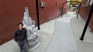 Sean Hunter Williams with his granite sculpture "Culmination"