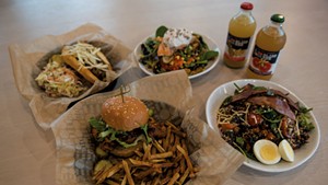 Clockwise from bottom: crispy chicken sandwich with hand-cut fries, Vermont hot dog, salmon salad, Bliss Bee sodas and a Sunrise grain bowl