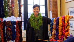 Heidi Fortsch of Brown Dog Fiber Arts in Chazy, NY holds up her work at Fiber Fair Friday