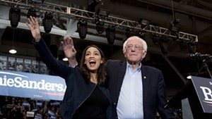 Sen. Bernie Sanders (I-Vt.) and Rep. Alexandria Ocasio-Cortez (D-N.Y.) taking the stage at the Whittemore Center Arena at the University of New Hampshire
