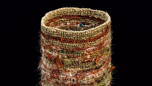 Colorful finger-weave twined bag made by Vera Sheehan of the Elnu Tribe. This is an ancient, traditional way of making bags from milkweed or other fiber material.