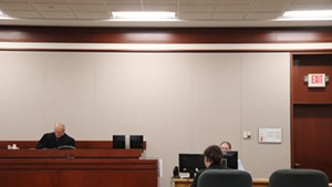Judge Gregory Rainville presiding over a hearing in Chittenden County Superior Court on Monday