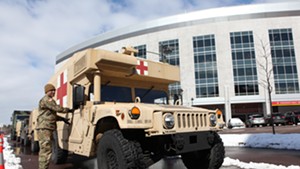 Vermont National Guard members arriving at the University of Vermont Medical Center to set up tents