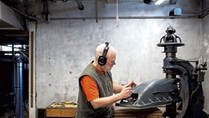 Mark McKerley cuts material at Vermont Glove's facility in Randolph