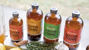 Fresh ingredients and finished Yerbary Master Tonic products