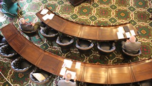 Lawmakers keep their distance last month in the Vermont Senate chamber